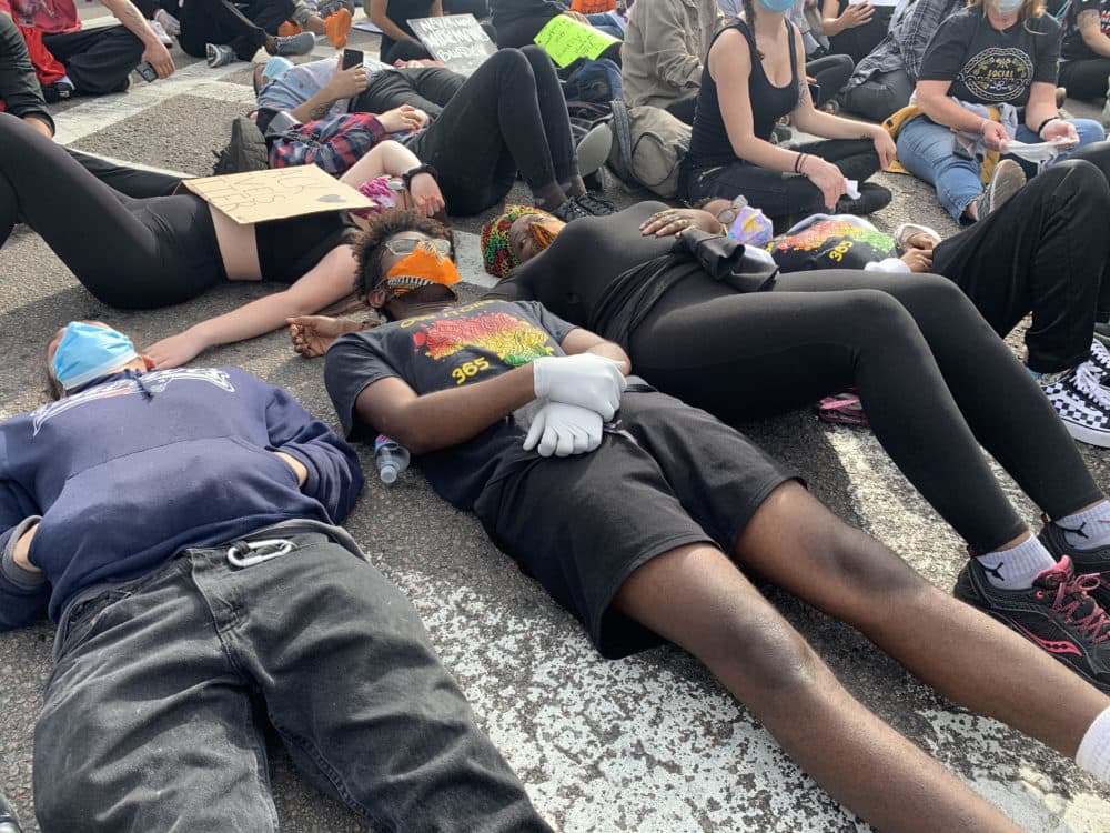 Some protesters participated in the &quot;die-in&quot; at the march. (Jesse Costa/WBUR)