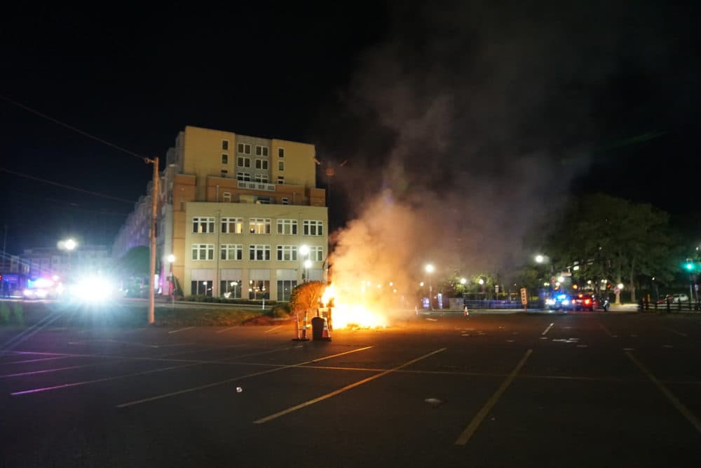 At Providence Place Mall on Monday night, some protesters smashed windows and set small fires in trash cans and on sidewalks.(The Public's Radio/RIPR)