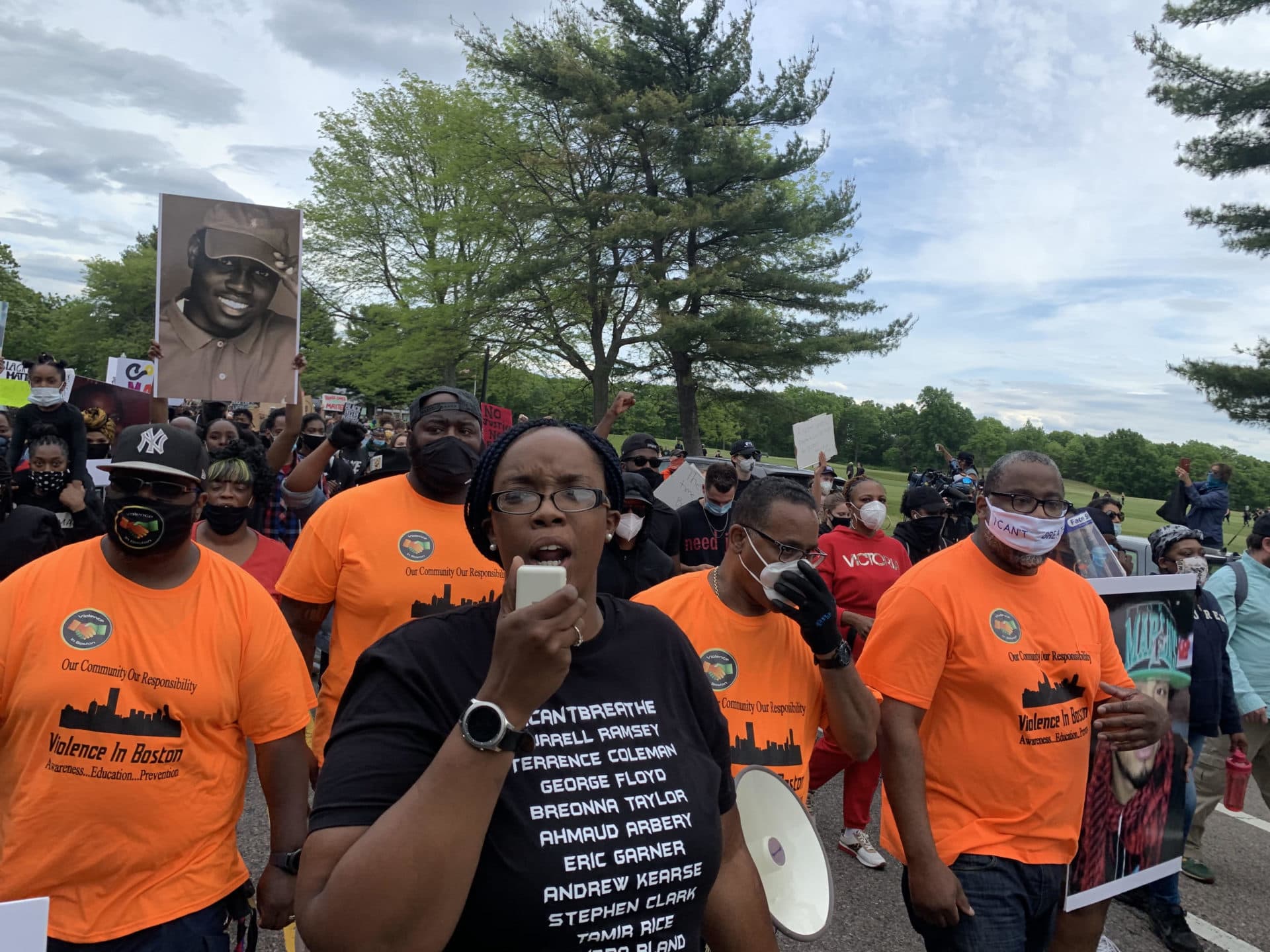 Monica Cannon-Grant, center, leads the march. (Jesse Costa/WBUR)