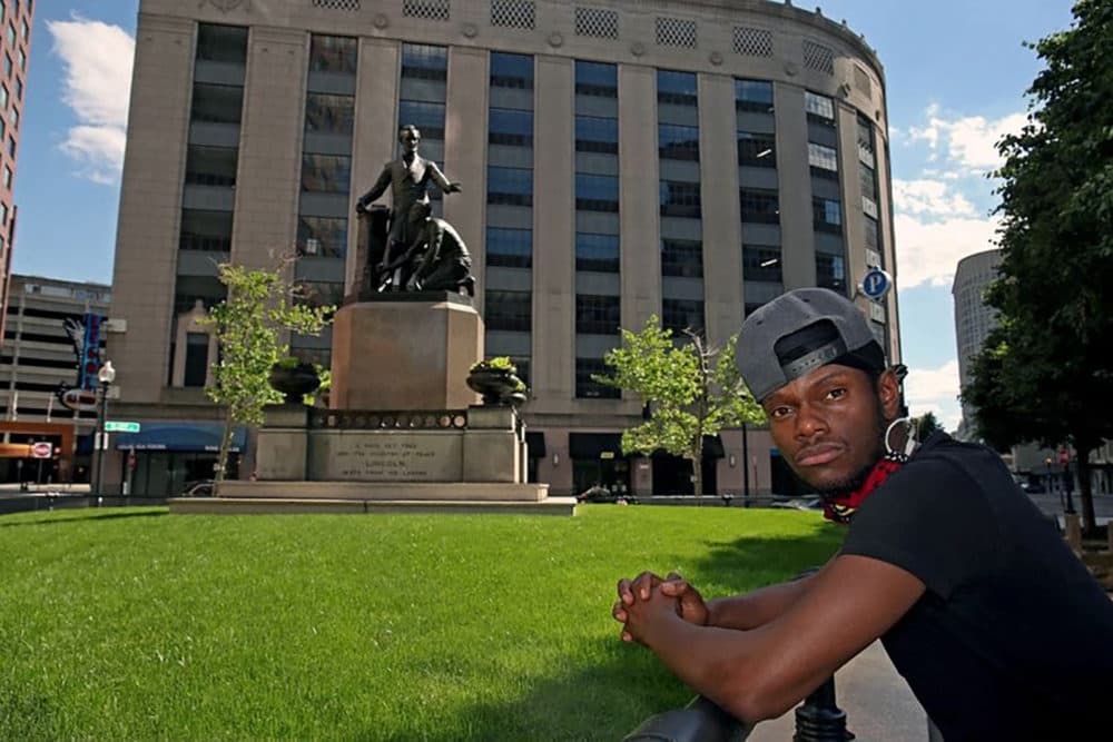 Artist Tory Bullock and the Emancipation Memorial in Boston. (Courtesy)
