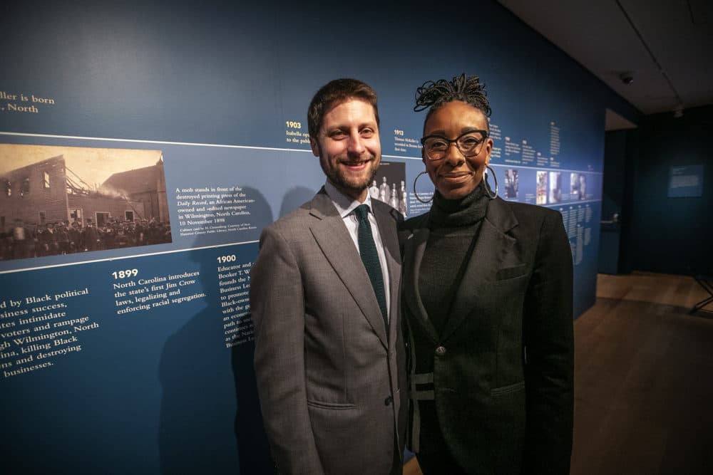 Nathaniel Silver and Theo Tyson stand in front of “McKeller’s Timeline,” part of the Boston’s Apollo exhibit at the Isabella Stewart Gardner Museum. (Jesse Costa/WBUR)