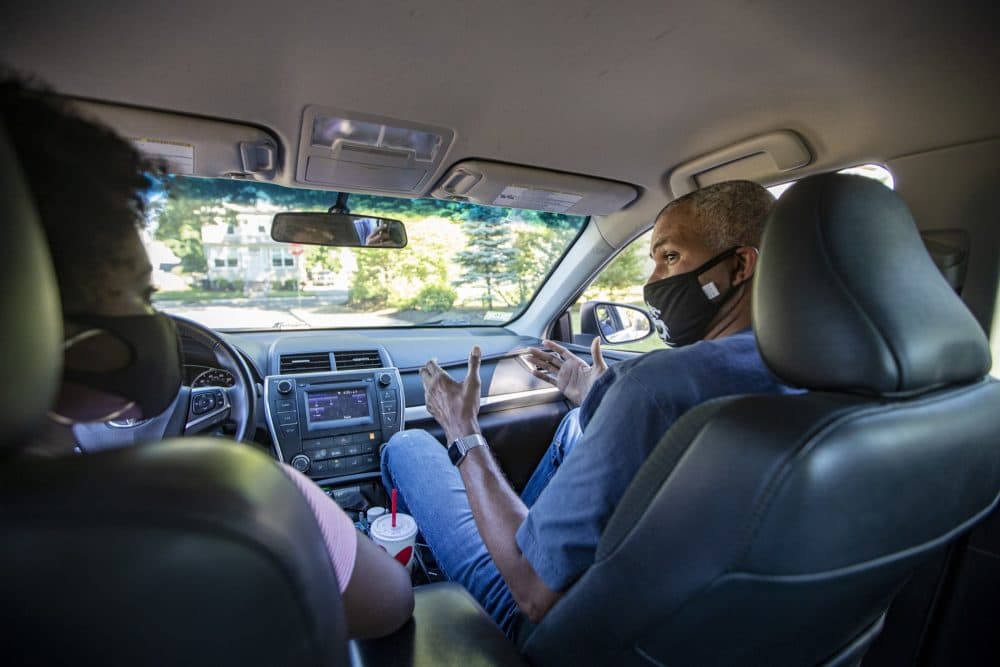 Driving instructor Domingo Montiero explains the fundamentals of parallel parking to Tahlia Tah during her driving lesson. (Jesse Costa/WBUR)