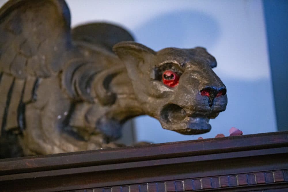 A prized possession of Rita Hester's was a gargoyle that now sits on a bookcase in Kathleen Hester’s home. (Jesse Costa/WBUR)