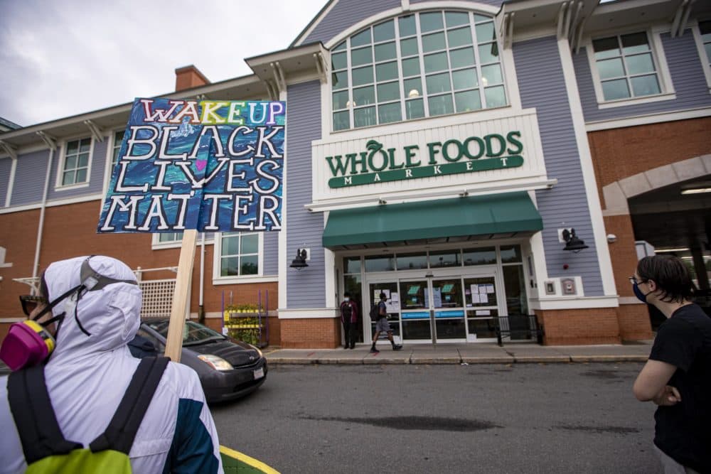 On a recent weekday, supporters of employees wanting to wear Black Lives Matter masks during their shifts gathered outside the store. (Jesse Costa/WBUR)
