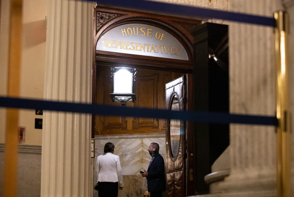 As the third day of House debate on policing reform stretched into the night, House Judiciary Chair Claire Cronin and Rep. Paul Tucker, a retired police chief, conversed in a chamber entryway. (Sam Doran/SHNS)