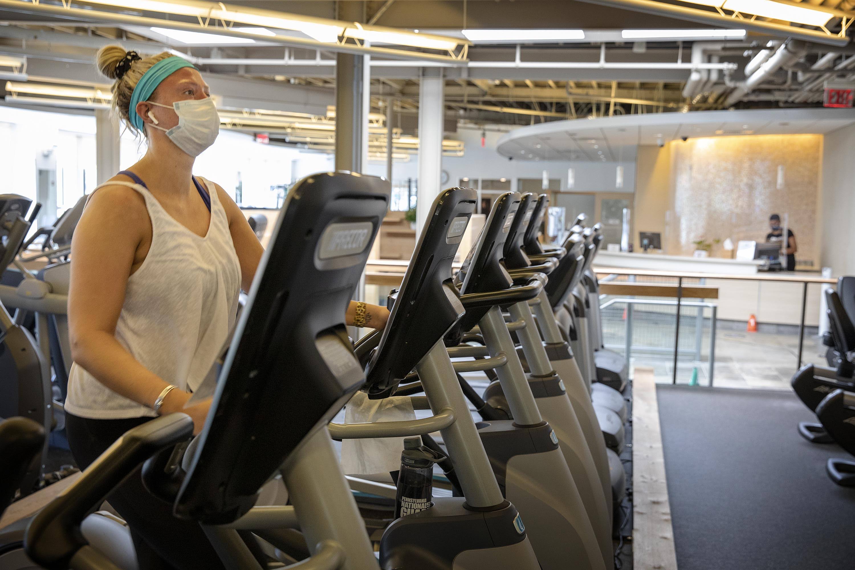 As gyms in Massachusetts start to open up again, Courtney Nowicki from Brookline gets back to her workout at Healthworks in Coolidge Corner. (Robin Lubbock/WBUR)