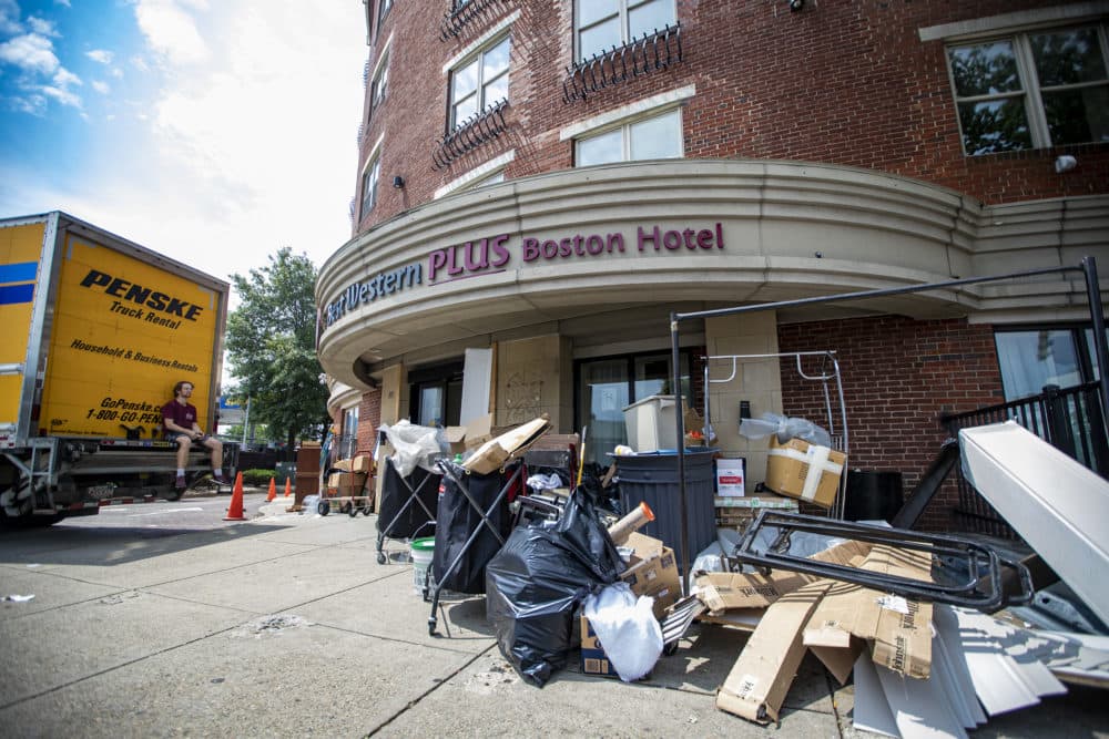 Discarded material sits outside the former Best Western Hotel on Massachusetts Avenue in Boston. (Jesse Costa/WBUR)