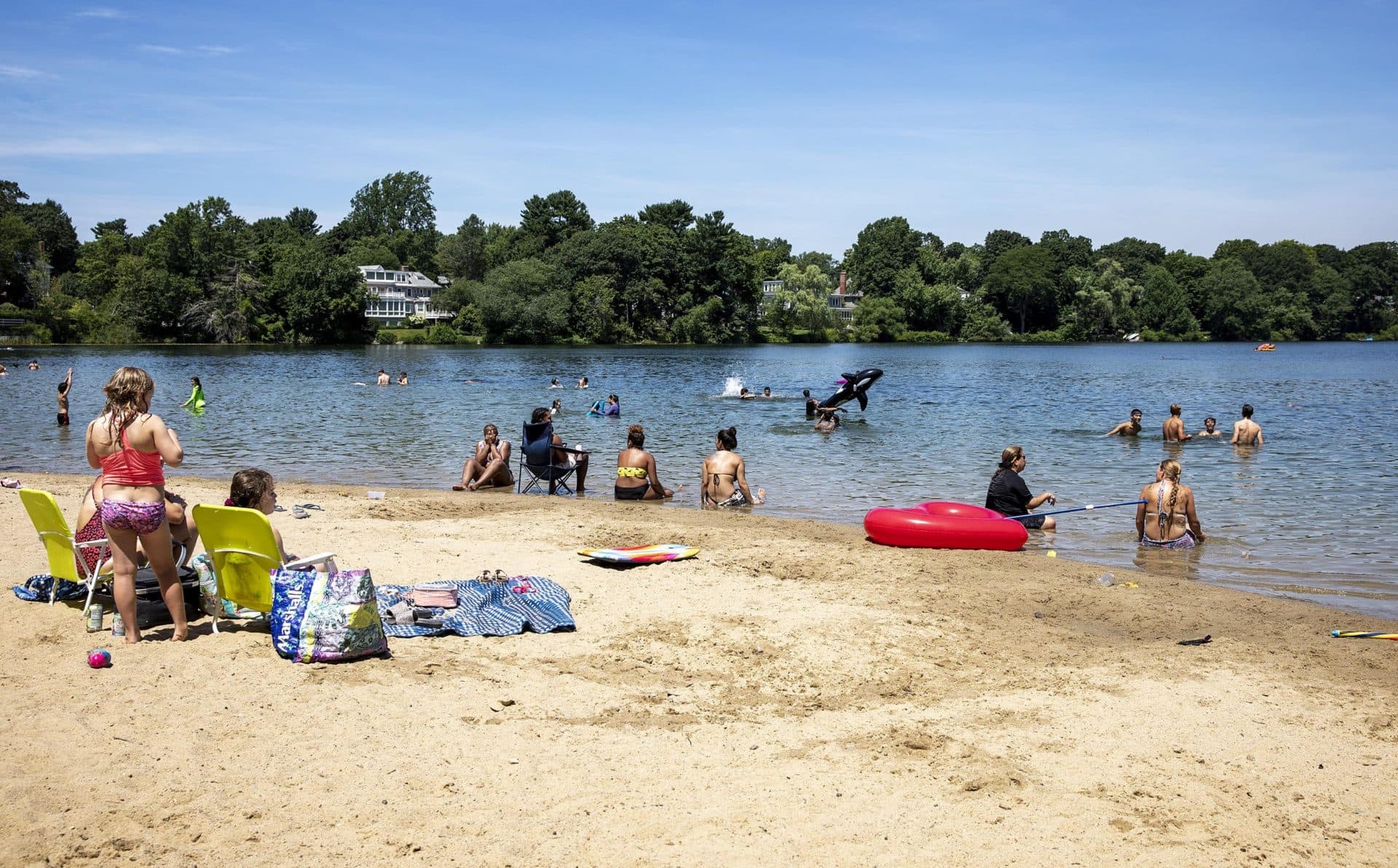 Beachgoers stay cool in the heat at Crystal Lake in Newton. (Robin Lubbock/WBUR)