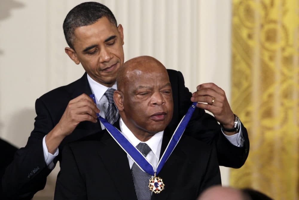 In this Feb. 15, 2011, file photo, President Barack Obama presents a 2010 Presidential Medal of Freedom to U.S. Rep. John Lewis, D-Ga., during a ceremony in the East Room of the White House in Washington. (Carolyn Kaster/AP Photo)