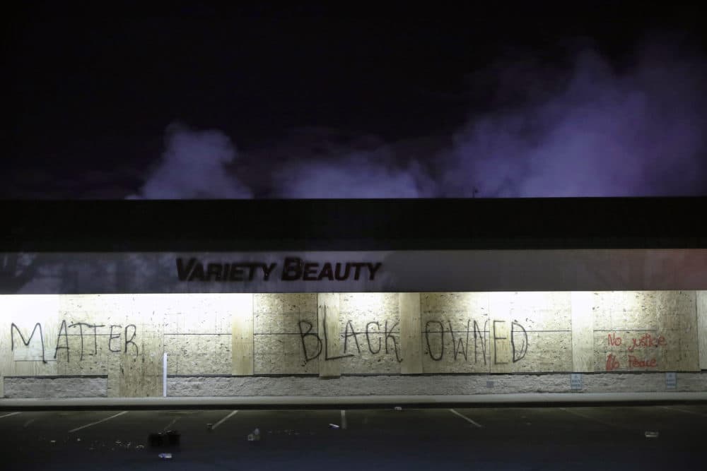 A business labeled &quot;Black Owned&quot; remains untouched on May 29, 2020, in Minneapolis. (John Minchillo/AP)