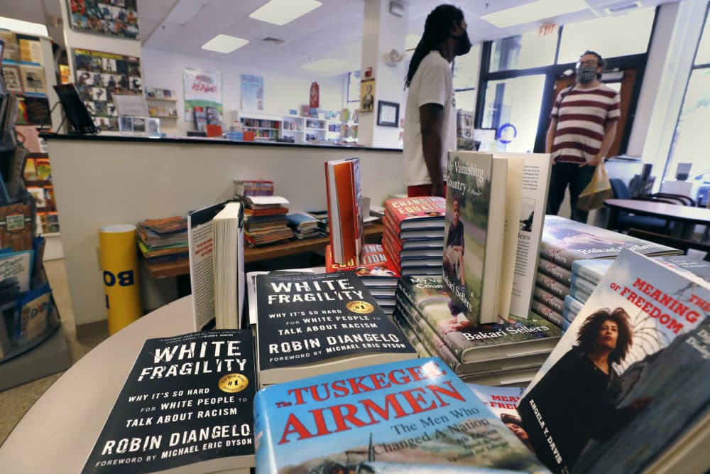 In this June 24, 2020, photograph, books are displayed, including &quot;The Tuskegee Airmen,&quot; and &quot;White Fragility,&quot; at the Black-owned Frugal Bookstore in the Roxbury neighborhood of Boston. (Charles Krupa/AP)