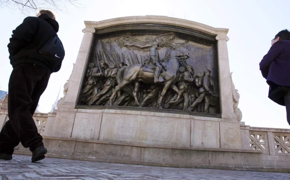 In this March 26, 2011, file photo, people walk past the memorial to Union Col. Robert Gould Shaw and the 54th Massachusetts Volunteer Infantry Regiment, near the State House in Boston.(Michael Dwyer/AP File)