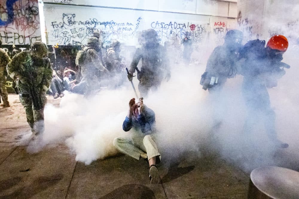 Federal officers use chemical irritants and crowd control munitions to disperse Black Lives Matter protesters outside the Mark O. Hatfield United States Courthouse on Wednesday, July 22, 2020, in Portland, Ore. (Noah Berger/AP Photo)