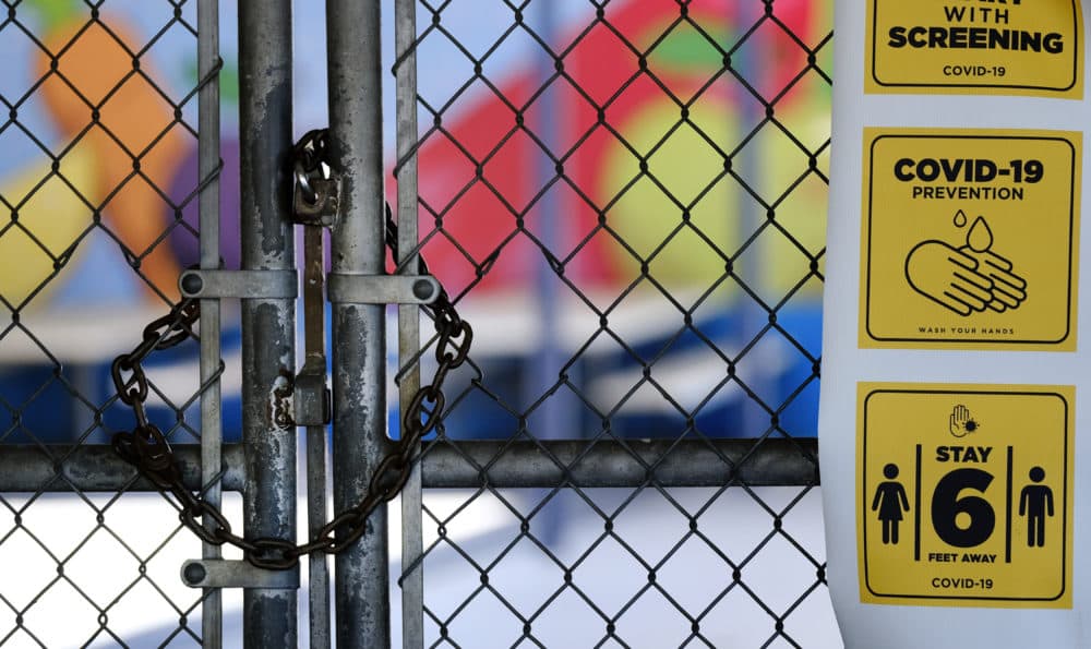 In this July 13, 2020, file photo, a chain-link fence lock is seen on a gate at a closed Ranchito Elementary School in the San Fernando Valley section of Los Angeles. (Richard Vogel/AP File)