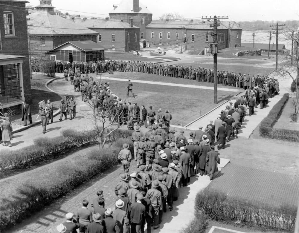 Over 1,800 recruits line up for their noon-day meal at the Civilian Conservation Corps (CCC) camp at Fort Slocum, N.Y., on April 9, 1933. The federal agency, CCC, established as part of the New Deal program initiated by the U.S. president provided employment and training for nearly 250,000 young men during the depression. (AP Photo)