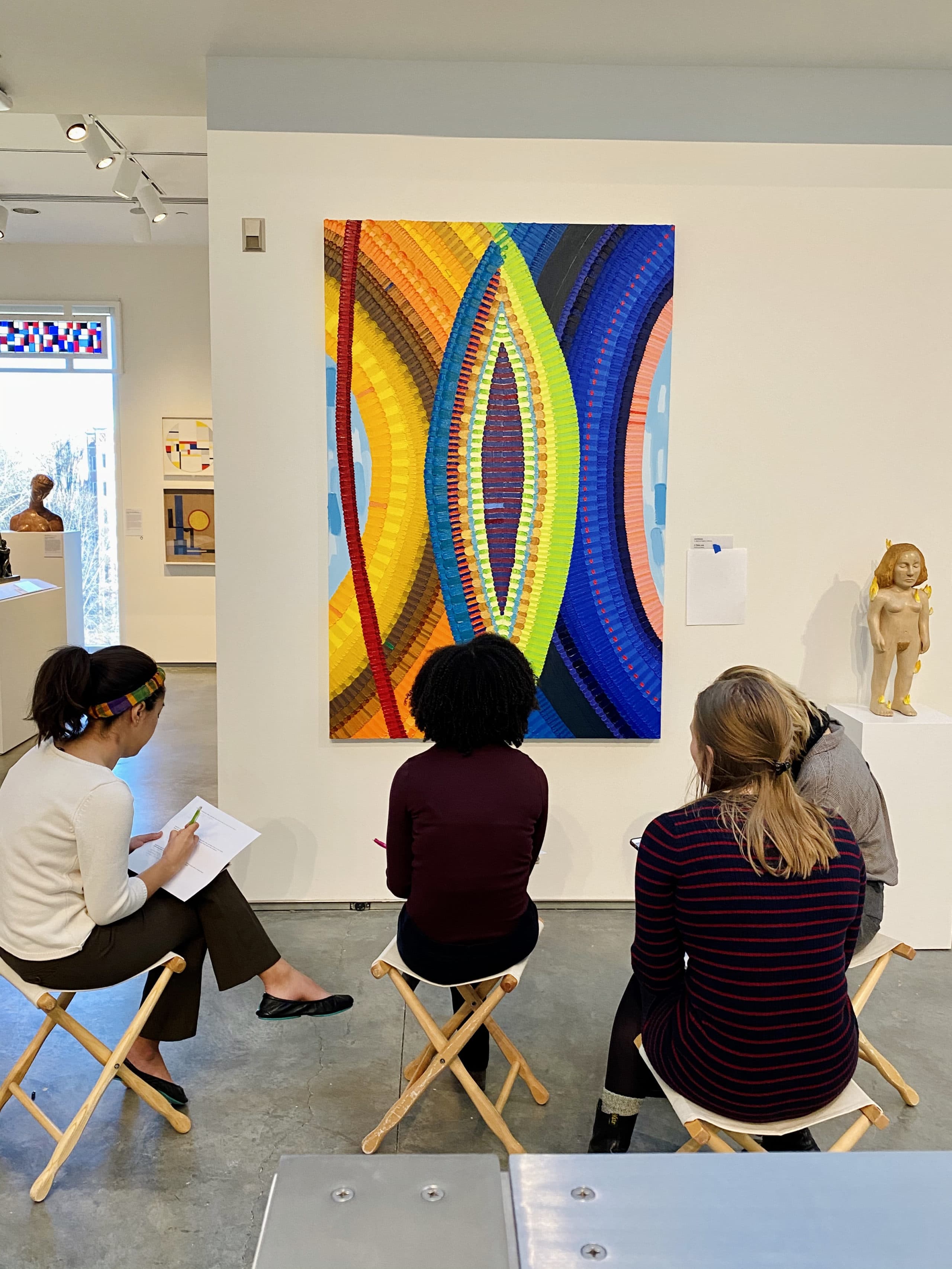 Wellesley College students studying June Edmonds's 2018 painting "A Tisket." (Courtesy Davis Museum at Wellesley College)