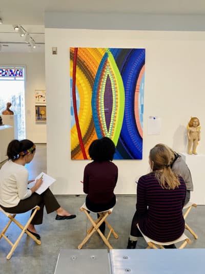 Wellesley College students studying June Edmonds's 2018 painting &quot;A Tisket.&quot; (Courtesy Davis Museum at Wellesley College)