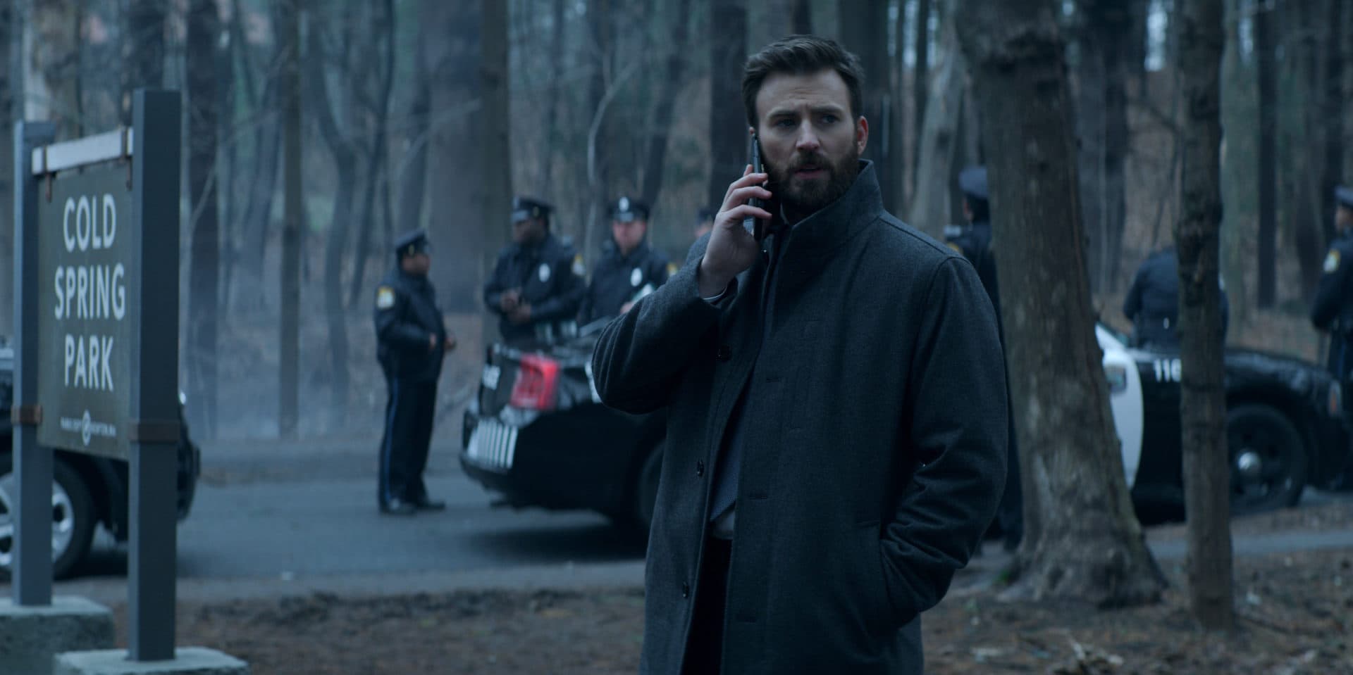 The show &quot;Defending Jacob&quot; was filmed on location in Massachusetts. Actor Chris Evans is seen standing near the sign for Cold Spring Park in Newton in a still from episode two. (Courtesy Apple TV+)
