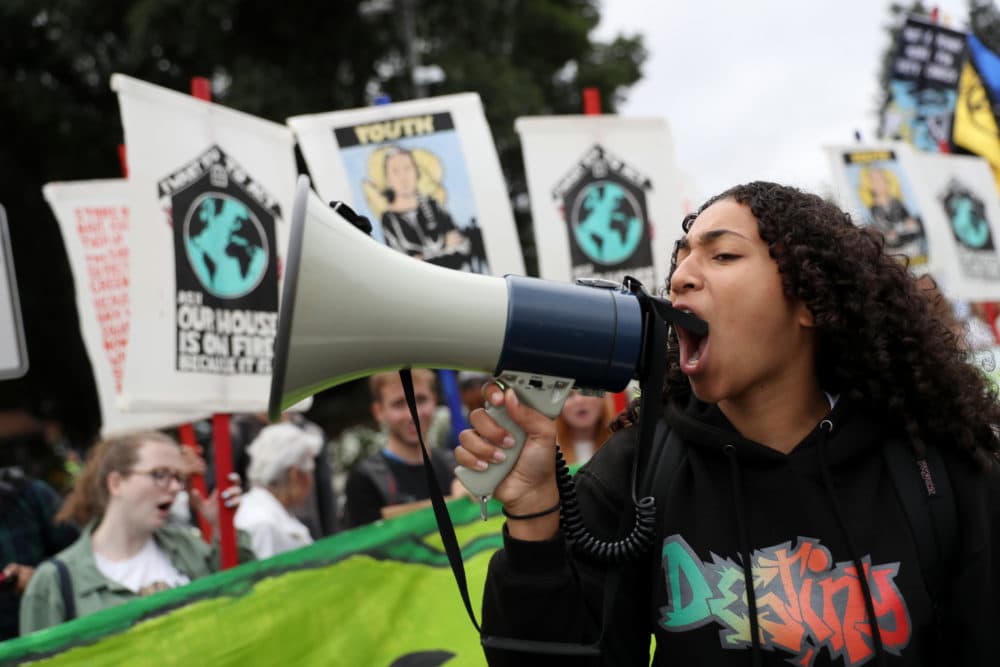 A youth climate activist uses a bullhorn as she leads a chant during a Climate Strike youth protest outside of Chevron headquarters on September 27, 2019 in San Ramon, California. (Justin Sullivan/Getty Images)