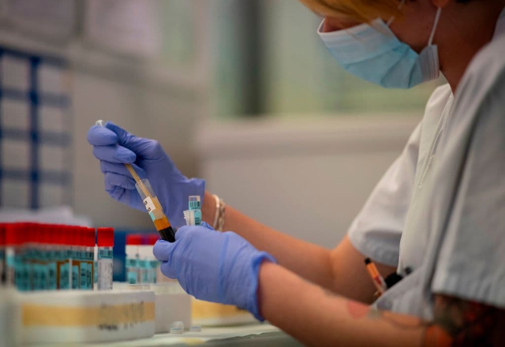 A scientist works at the serology laboratory of the San Carlos Clinic Hospital in Madrid on June 16, 2020. (Pierre-Philippe Marcou/AFP/Getty Images)