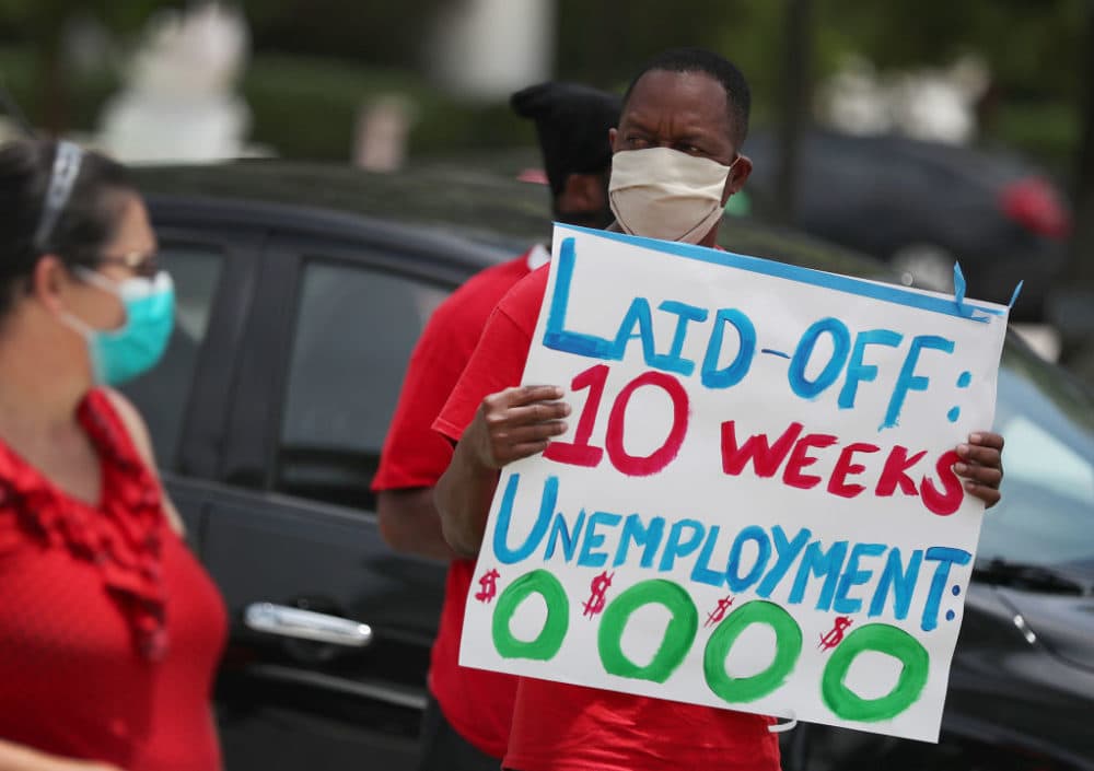 Joseph Louis joins others in a protest asking the state of Florida to fix its unemployment system on May 22, 2020 in Miami Beach, Florida. (Joe Raedle/Getty Images)