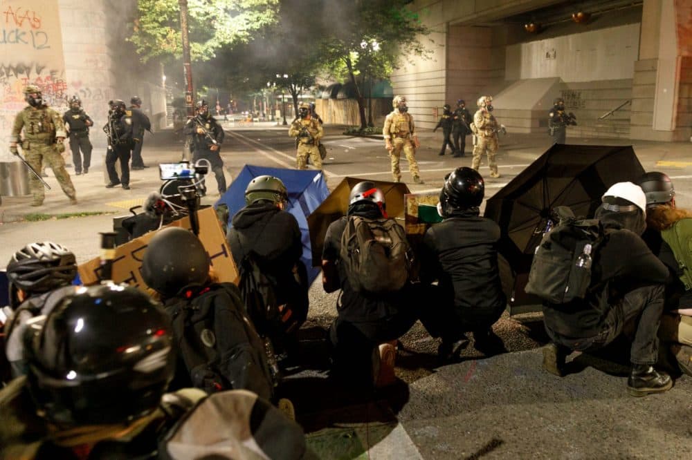 Protesters use shields and umbrellas against the Federal forces in Portland, Oregon on July 21, 2020. Over a thousand people, including a large march of mothers, demonstrated for racial justice and against Donald Trumpâs insertion of Federal officers in Portland, Oregon. (John Rudoff/Anadolu Agency via Getty Images)