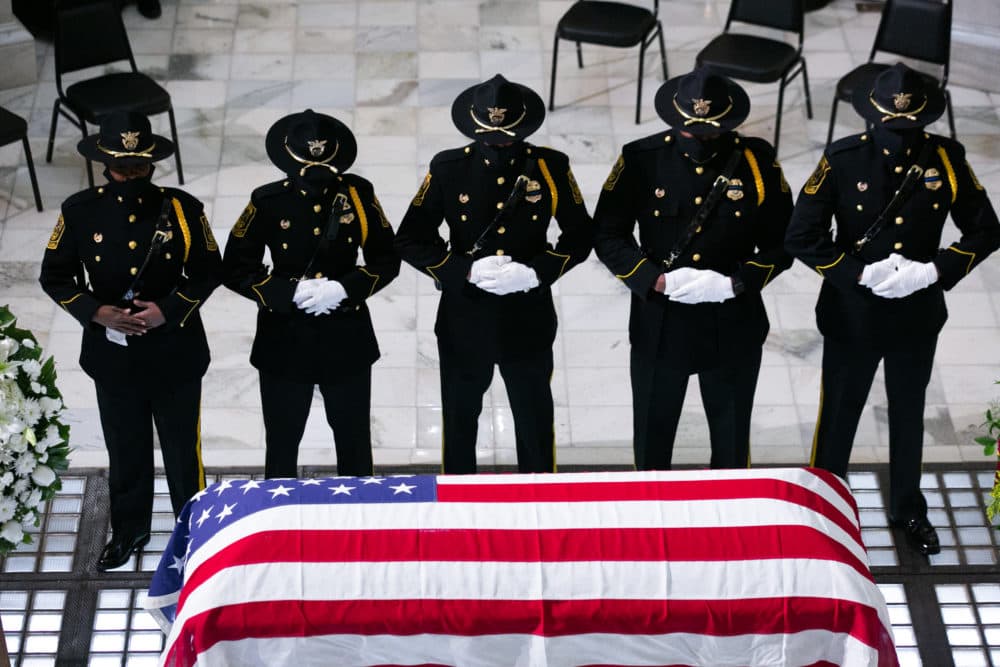 Members of the Fulton County Sheriff's Office Honor Guard stand at attention in front of former US Rep. John Lewis (D-GA) as he lies in state at the Georgia State Capitol on July 29, 2020 in Atlanta, Georgia. (Jessica McGowan/Getty Images)