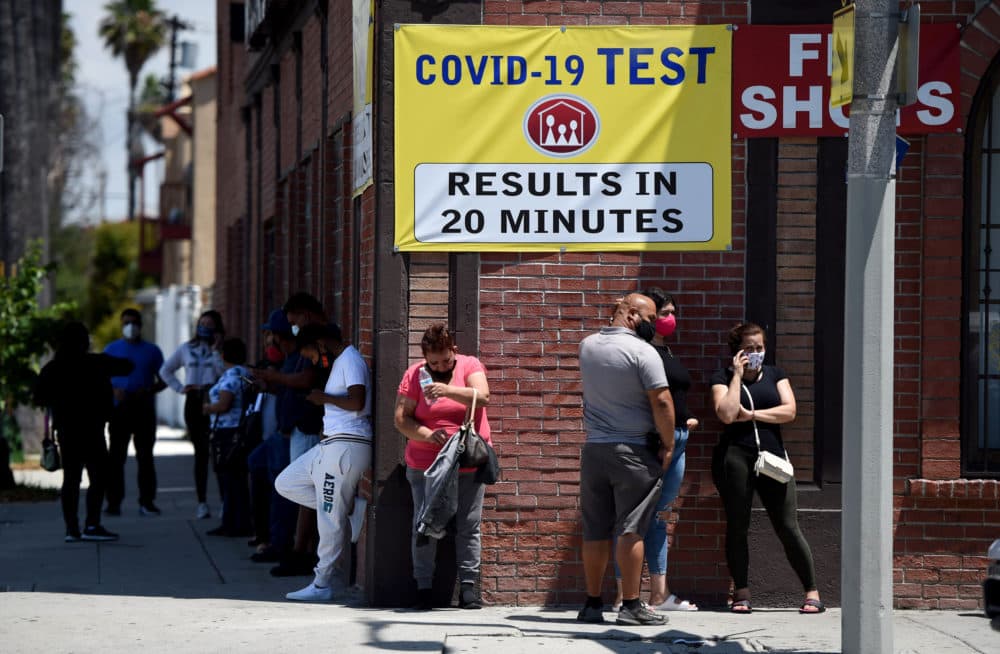 People stand in line at a clinic offering quick coronavirus testing for a fee in Wilmington on Monday, June 29, 2020. (Photo by Brittany Murray/MediaNews Group/Long Beach Press-Telegram via Getty Images)