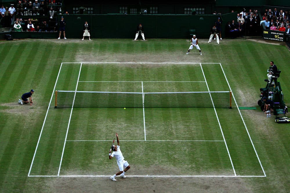 Even at Wimbledon, it's impossible to keep grass courts perfectly green. (Ian Walton/Getty Images)