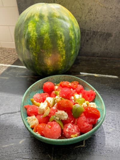 Watermelon, roasted cherry tomatoes, feta, mint and green olive salad. (Kathy Gunst/Here &amp; Now)