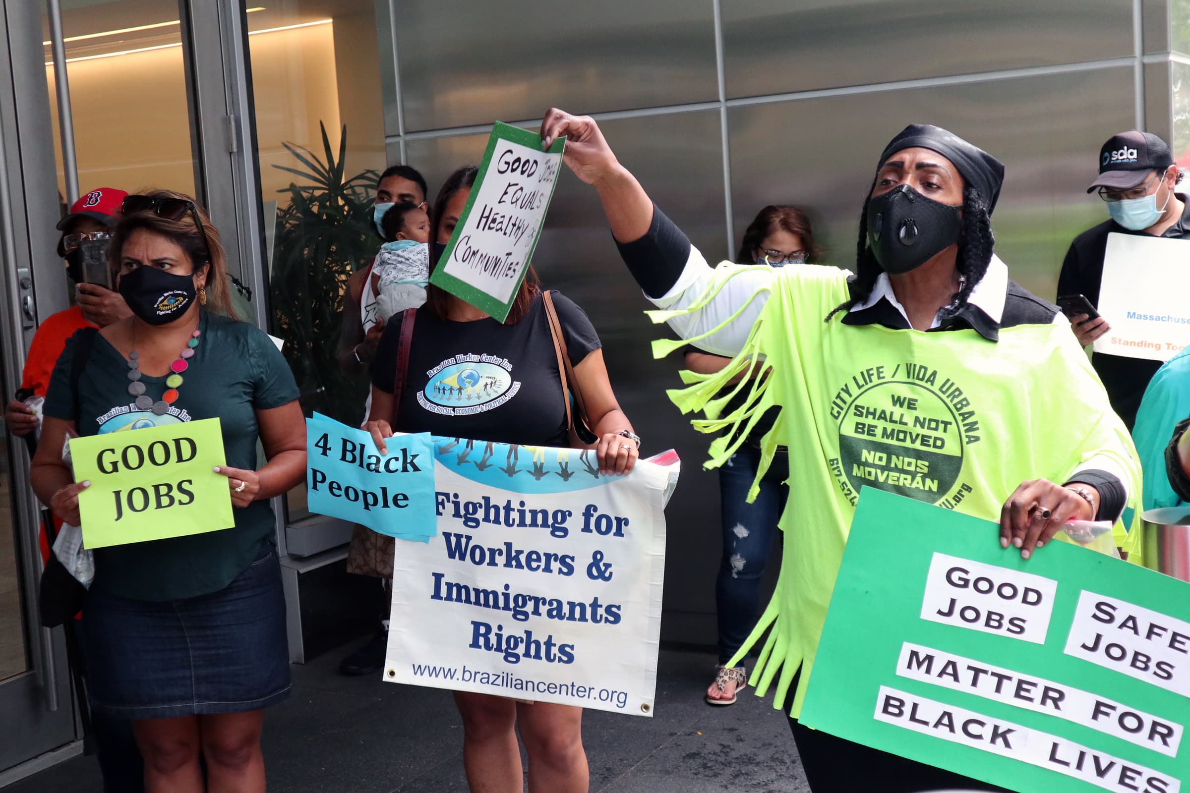 Protesters gathered at the front entrance of Vertex Pharmaceuticals in Seaport neighborhood. (Adrian Ma / WBUR)