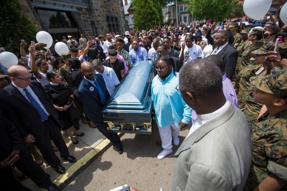 Pallbearers carry the casket of 17-year-old Raekwon Brown, who was murdered near his high school in Dorchester in 2016. (Jesse Costa/WBUR)