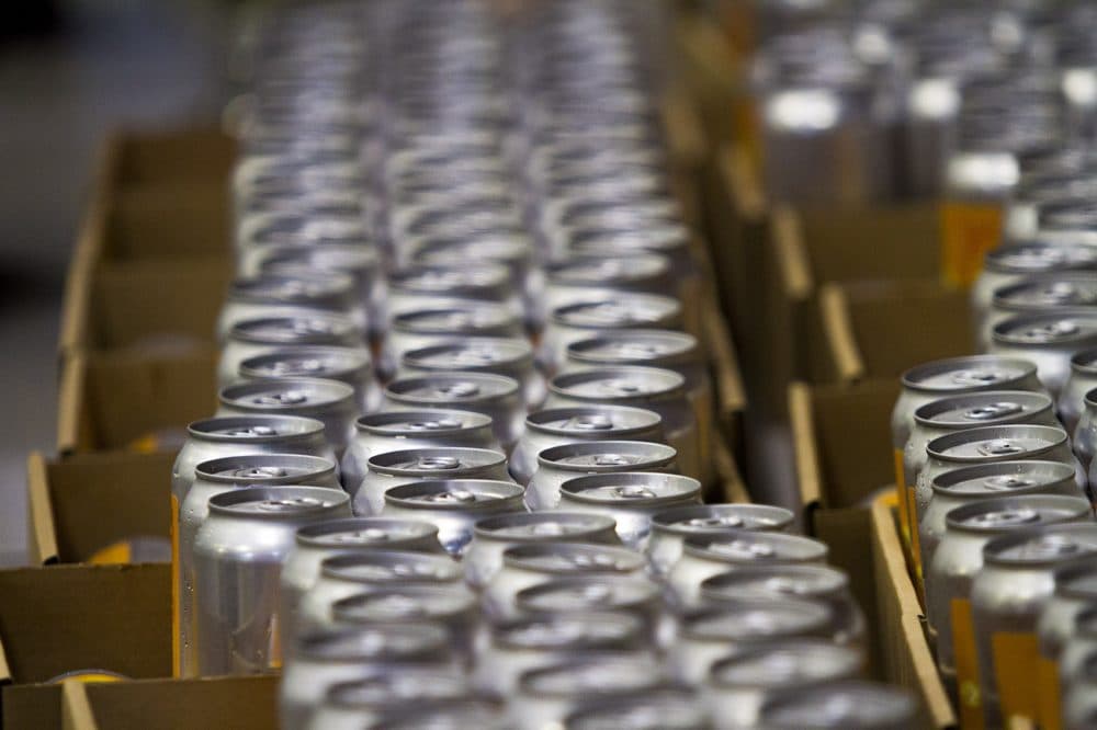 Cans of beer packed up at Tree House Brewing Co. in 2017. (Jesse Costa/WBUR)