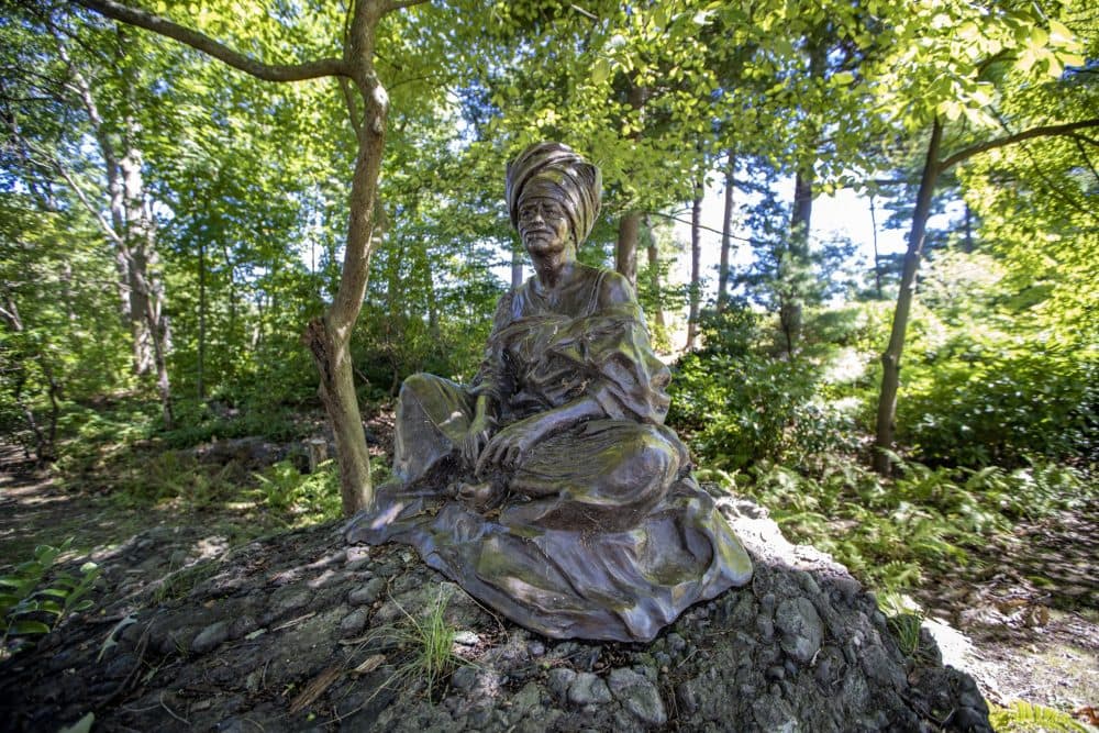 &quot;The Sentinel&quot; by Fern Cunningham depicts an African woman watching over the Forest Hills Cemetery. (Jesse Costa/WBUR)