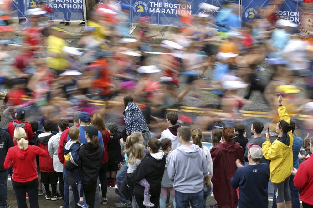 In this April 15, 2019 photo, fans cheer on the third wave of runners at the start of the 123rd Boston Marathon in Hopkinton, Mass. The 2020 Boston Marathon was canceled because of the COVID-19 pandemic for the first time in its 124-year history. (Stew Milne/AP)