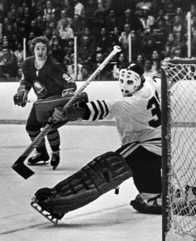 Brian Spencer, by 1974 a Buffalo Sabre, fires shot past Chicago Blackhawks goalie Tony Esposito. (Larry Stoddard/AP)