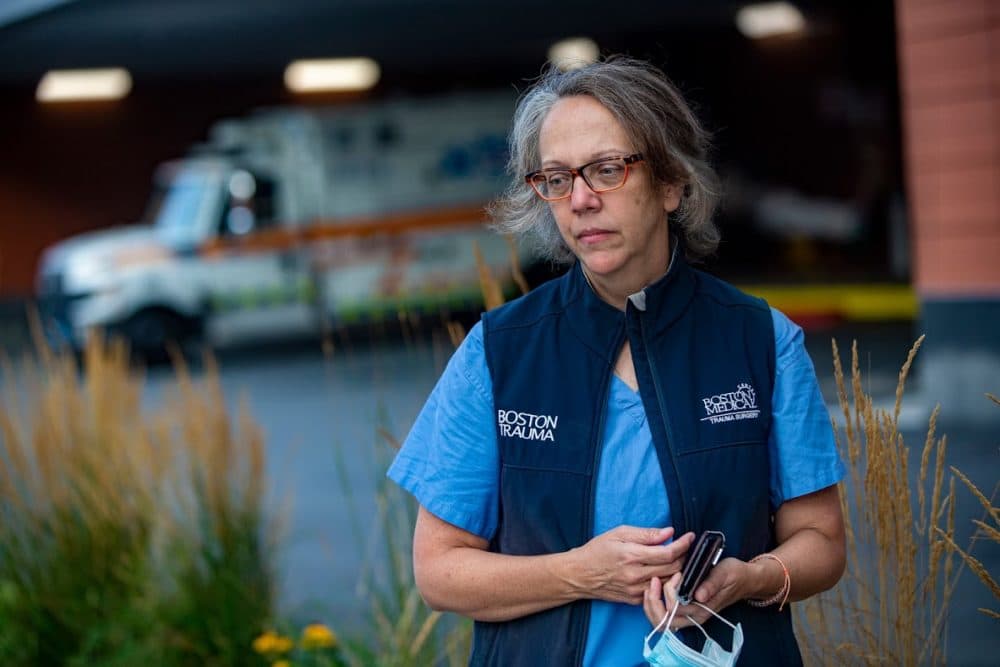 Trauma surgeon Dr. Tracey Dechert, who oversaw a COVID-19 intensive care unit during the pandemic surge, stands outside the emergency ambulance bay at Boston Medical Center. (Jesse Costa/WBUR)