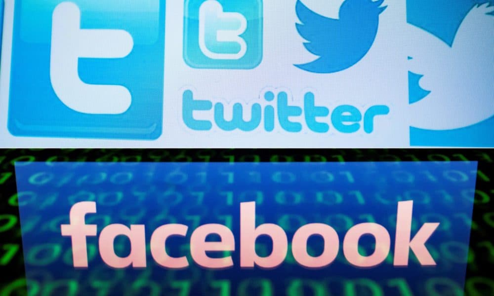 This combination of file pictures shows Twitter logos on a computer screen and the logo of social network Facebook. (Nicolas Asfouri,lionel Bonaventure/AFP via Getty Images)