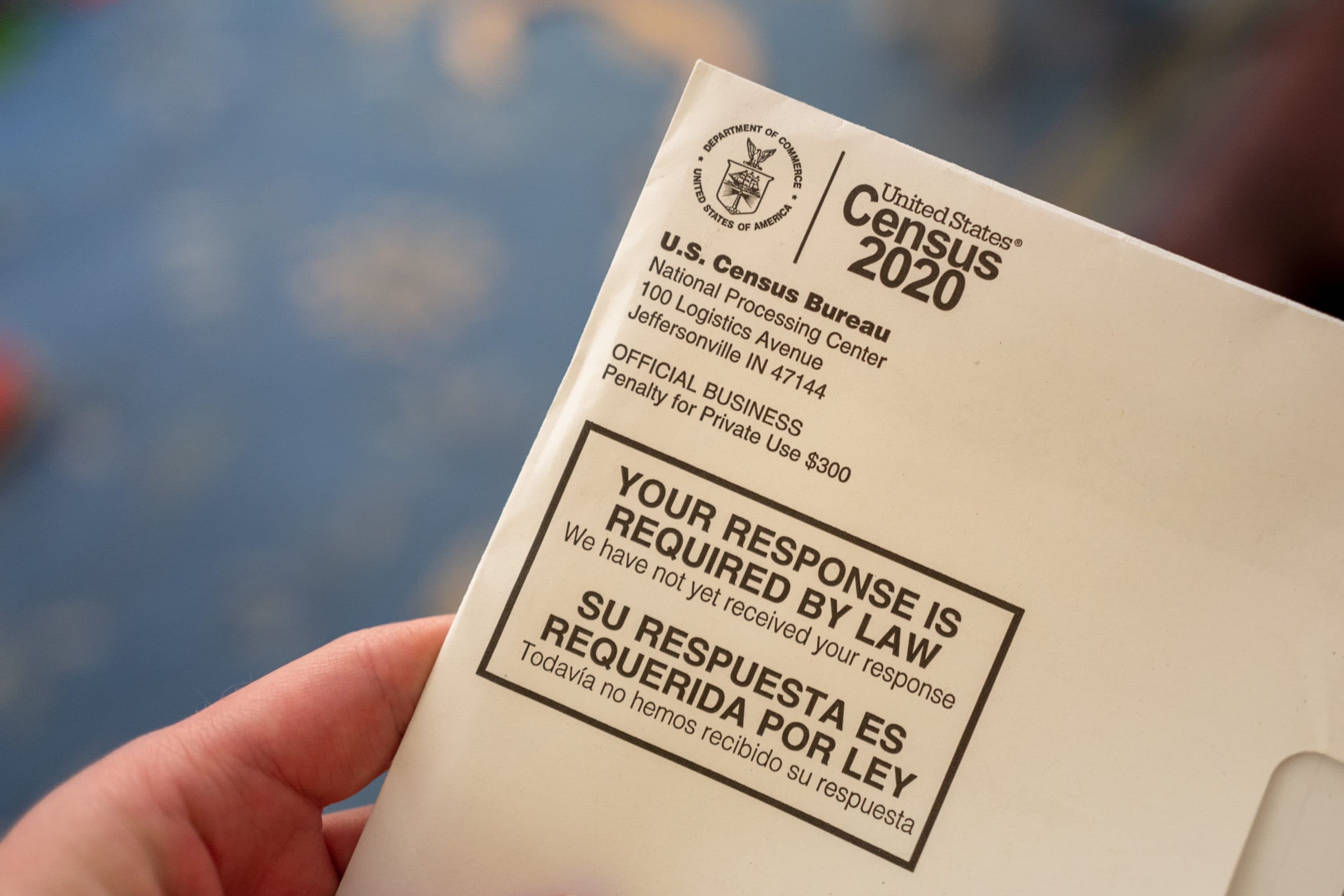 Close-up of human hand holding a letter from the Census Bureau regarding the 2020 Census, San Ramon, California, April 24, 2020. (Smith Collection/Gado/Getty Images)