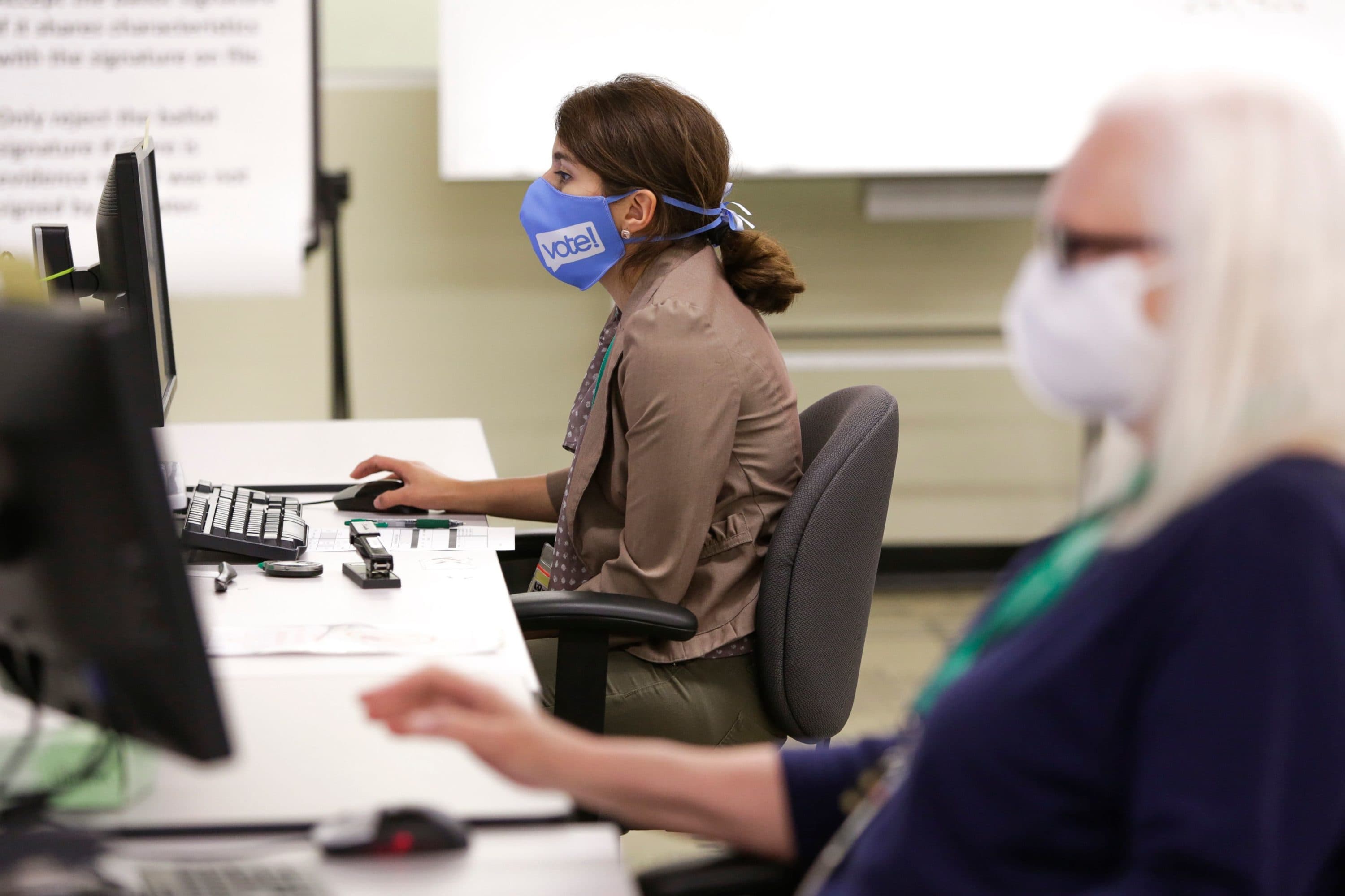 Election Worker Darleen Jara handles signature verifications as vote-by-mail ballots for the August 4 Washington state primary are processed at King County Elections in Renton, Washington on August 3, 2020. (Jason Redmond/AFP via Getty Images)