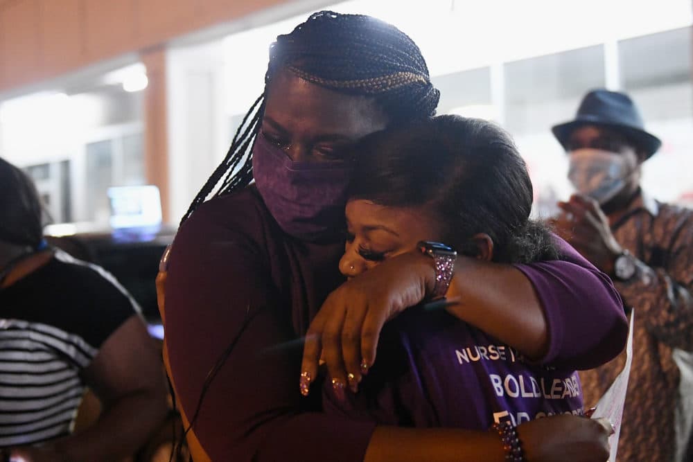 Cori Bush (L) hugs her daughter prior to giving her victory speech at her campaign office on August 4, 2020 in St. Louis, Missouri. (Michael B. Thomas/Getty Images)