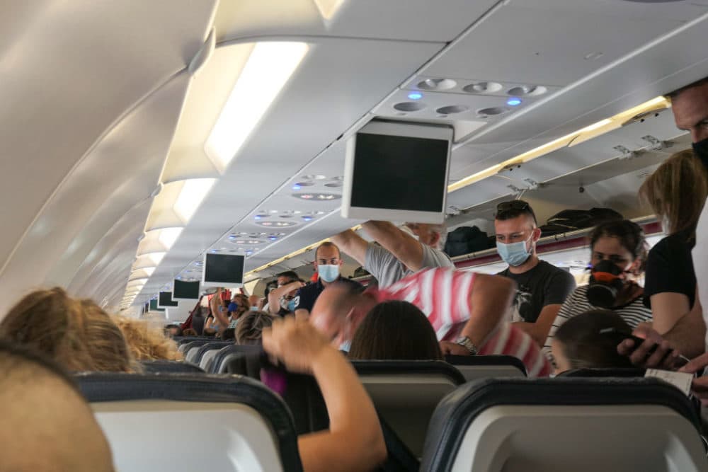 Passengers with facemasks boarding inside an Aegean Airbus A320. (Nicolas Economou/NurPhoto via Getty Images)