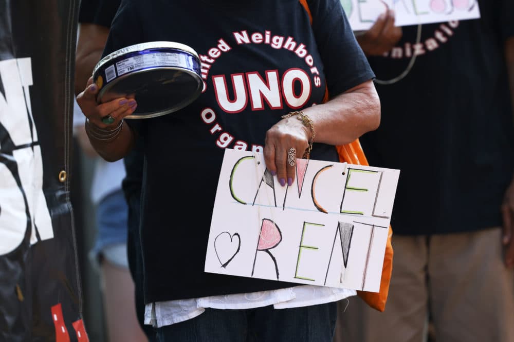 NEW YORK, NEW YORK - AUGUST 10: A demonstrator holds a sign as she listens to speakers during a 'Resist Evictions' rally to protest evictions on August 10, 2020 in New York City. The Right to Counsel NYC Coalition organized a day of action across New York City for tenants who are struggling to pay rent due to the COVID-19 public health crisis. Gov. Andrew Cuomo extended the eviction moratorium which ended on August 6, for an extra 30 days. (Photo by Michael M. Santiago/Getty Images)
