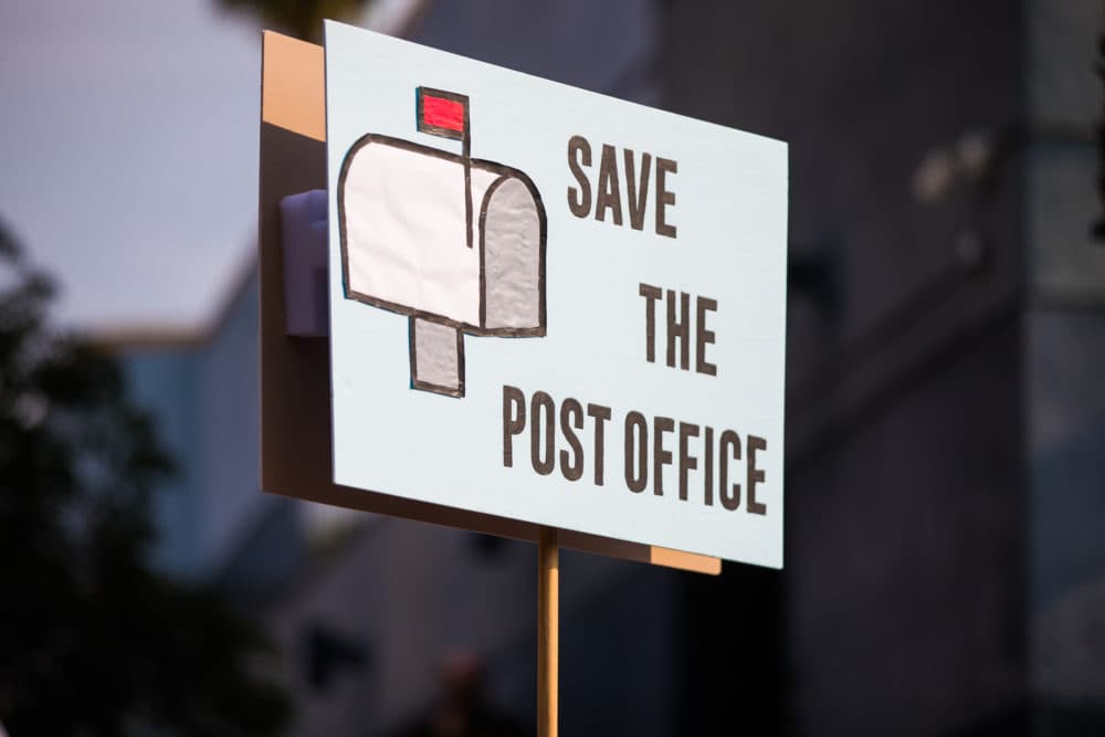 Rally goers gather at a post office to protest the Trump administration's handling of the US Postal System at the Rally to Save the Post Office on August 22, 2020 in Los Angeles, California. (Rich Fury/Getty Images for MoveOn)