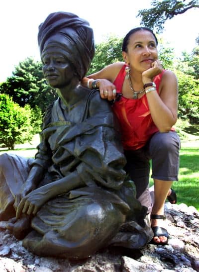 Artist Fern Cunningham-Terry of Boston with her sculpture &quot;The Sentinal,&quot; located in Forest Hills Cemetery. (Tom Herde/The Boston Globe/Getty Images)