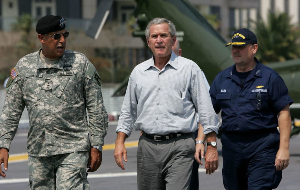 President George W. Bush (C) walks with U.S. Army Lt. General Russel Honoré (L) and U.S. Coast Guard Vice Admiral Thad Allen on the flight deck of the USS Iwo Jima September 20, 2005, in New Orleans, Louisiana. (Justin Sullivan/Getty Images)