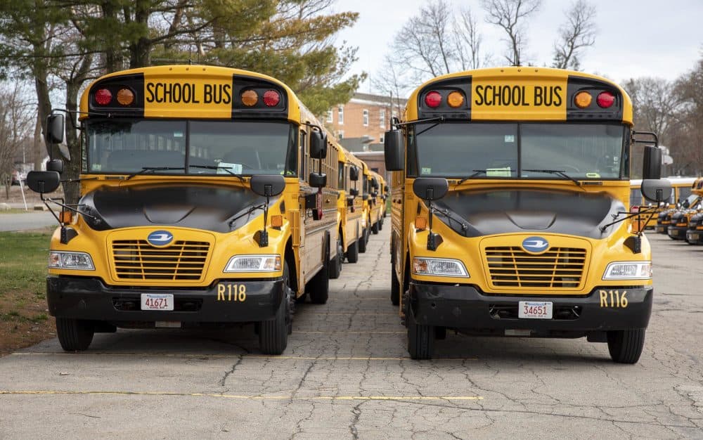 Randolph Public School buses parked behind the high school. Randolph High School ranked 114th in Boston Magazine's most recent ranking. (Robin Lubbock/WBUR)
