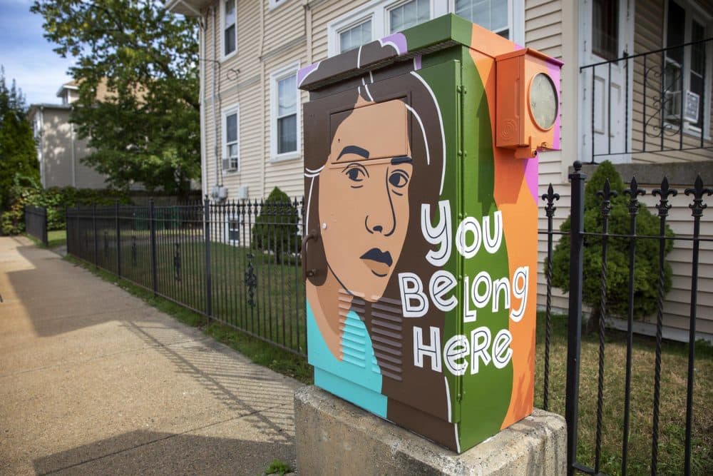 &quot;You Belong Here,&quot; painted by artist Amanda Beard Garcia on Harvard Street in South Medford. (Robin Lubbock/WBUR)