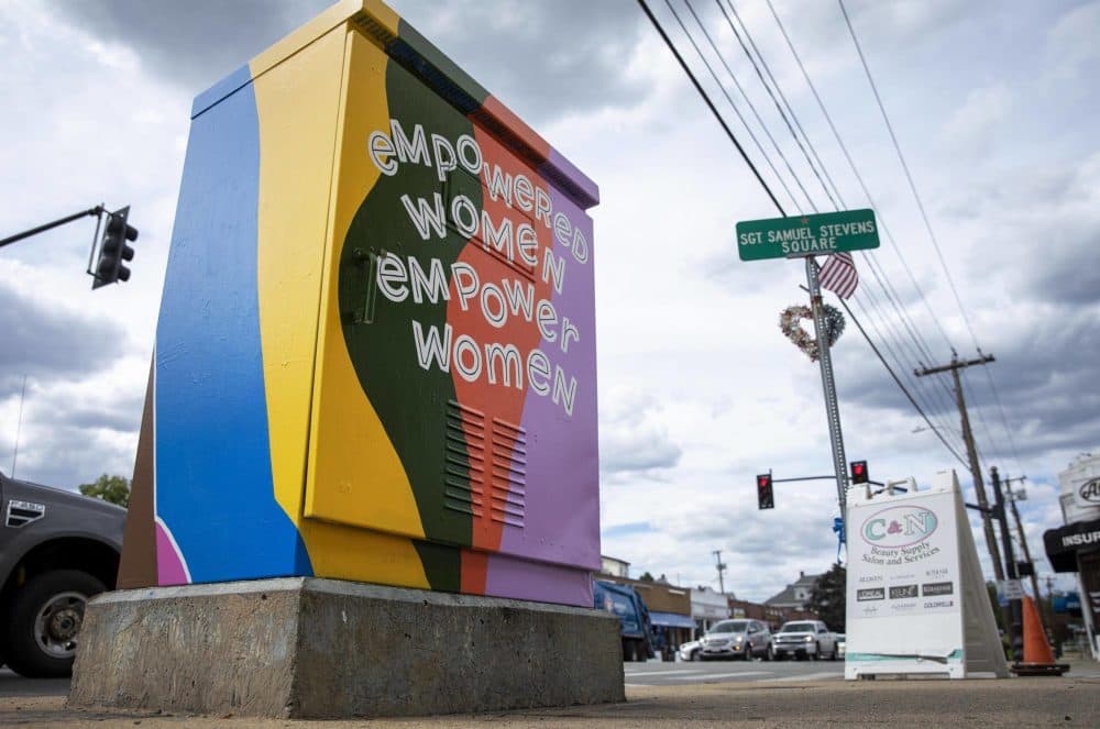 &quot;Empowered Women Empower Women,&quot; painted by artist Amanda Beard Garcia on Main Street in South Medford. (Robin Lubbock/WBUR)
