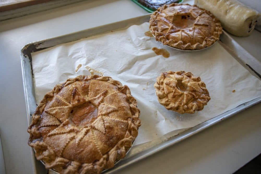 Peach pies on a sheet pan at Petsi Pies. (Jesse Costa/WBUR)